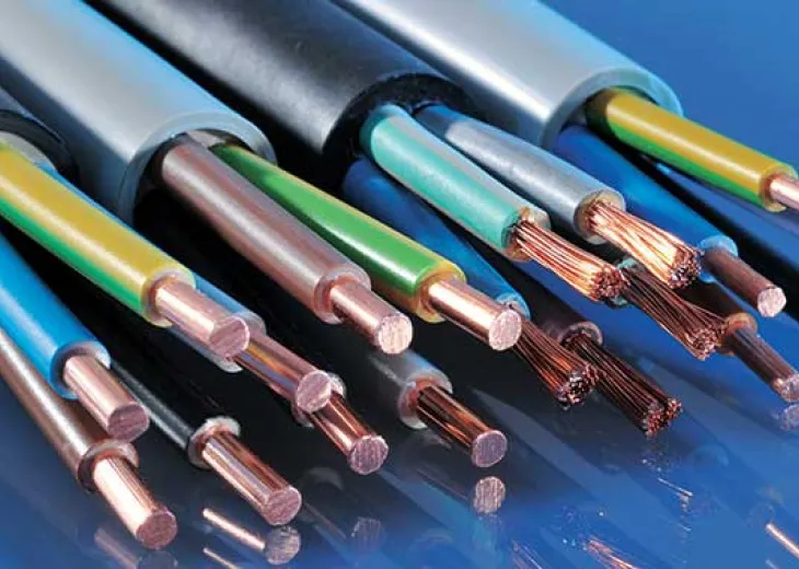 Close-up of several electrical cables with stripped ends, exposing copper wires and colored insulation, on a reflective blue surface.